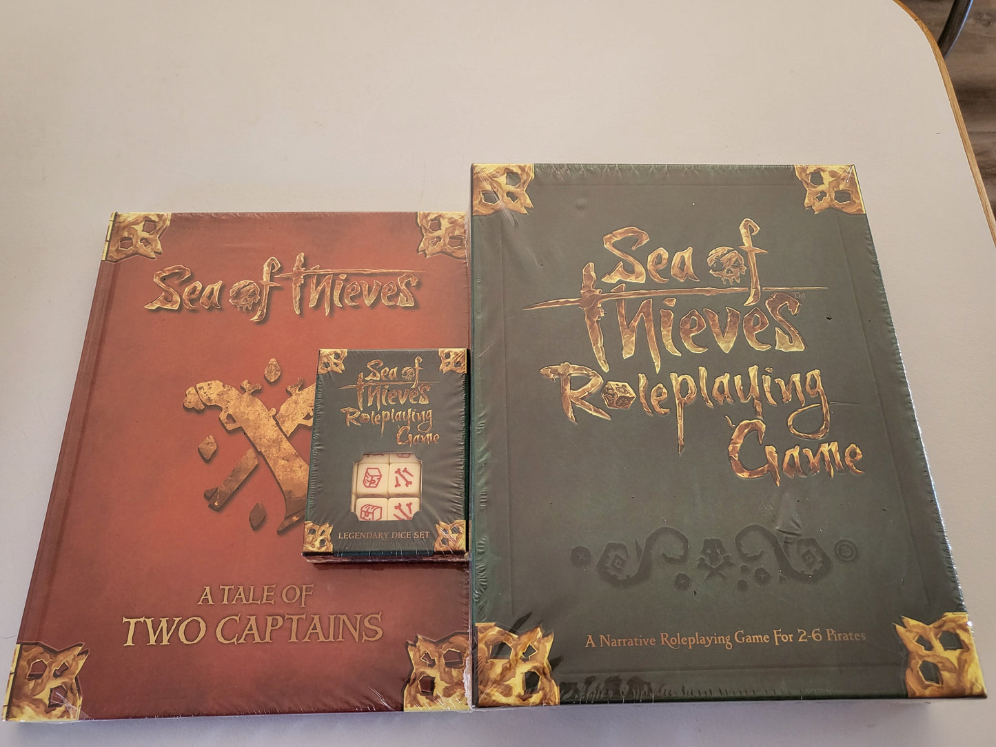 Sea of Thieves Roleplaying Game Combo (Base game, 1x Legendary Dice box and A Tale of Two Captains expansion)